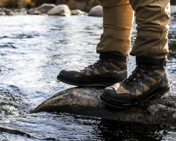 Person standing on a rock in a river