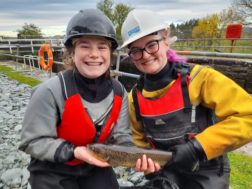 APEMs Fish Rescue Team holding brown trout