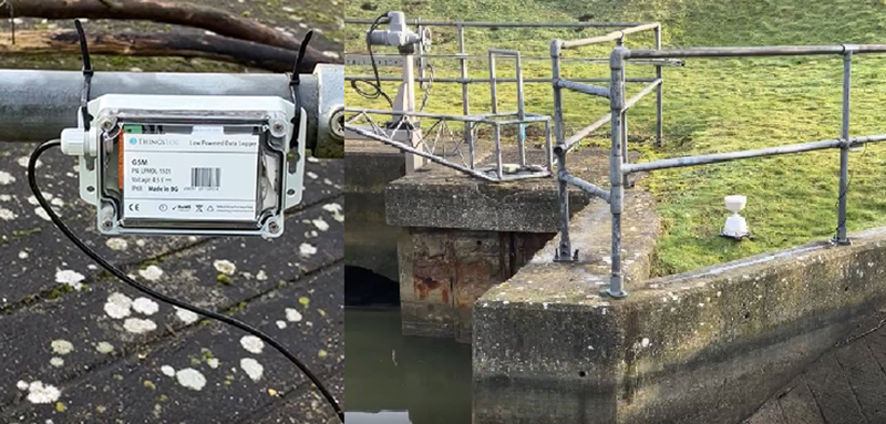 An image of a small control panel and a white plastic container used to capture rain